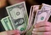 Dollar holds firm as Middle East hostilities lift oil