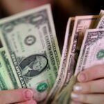 Dollar holds firm as Middle East hostilities lift oil
