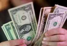 Dollar holds firm as Middle East hostilities lift oil