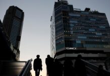Japan to sidestep funding in tax cut outline, keep fiscal concern alive