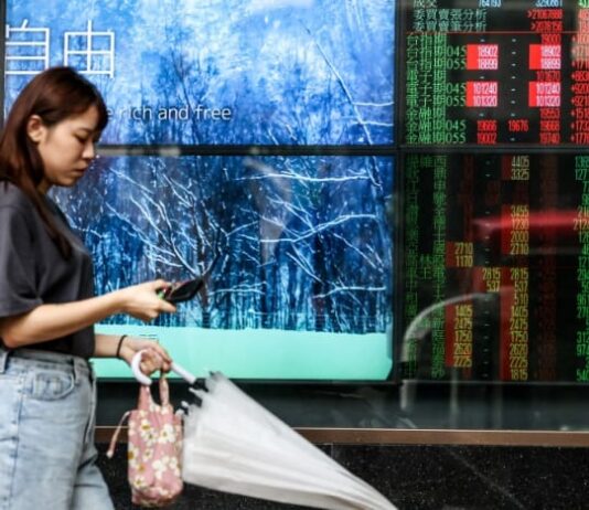 Most stocks rise as Fed hikes and oil prices drop