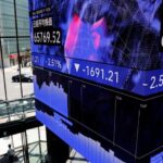 Shares tick higher as Fed hikes rates, dollar jumps with short-term yields
