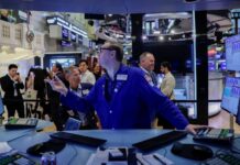 Wall Street dips, oil continues climb ahead of US inflation data