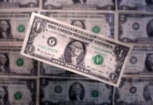 Dollar eases from 18-month high as Treasury yields fall; Fed hike bets ease