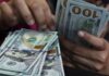 Dollar gains as oil climbs and investors focus on the Fed