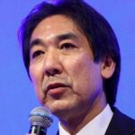 Japan is not yet officially out of deflation, economy minister says