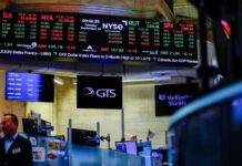 Nasdaq hits record as dollar and Treasury yields climb, oil prices ease