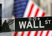 Wall Street firms tie bonuses, promotions to AI skills, survey finds