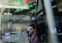 Wall Street futures dip after AI rout, telecoms slide